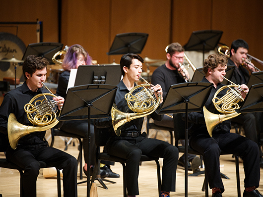 Performers with French horns