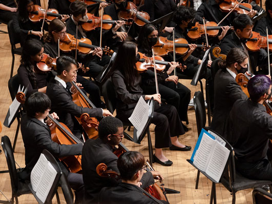 Philharmonia musicians performing onstage