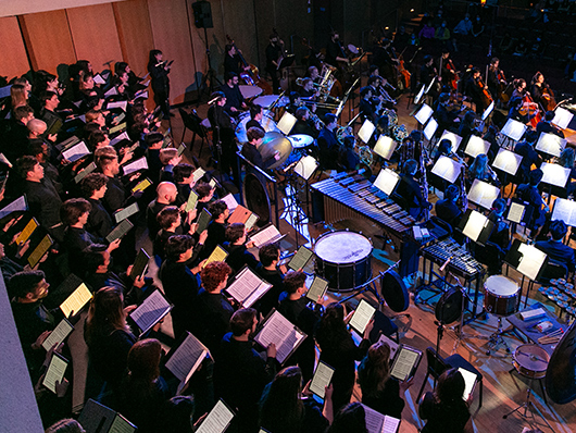 The Symphony Orchestra and Northwestern choirs performing together onstage
