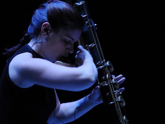 Flutist Erin Lesser in performance with her instrument