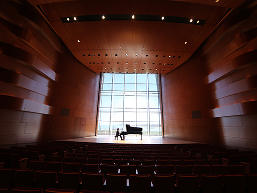 A piano onstage at Galvin Recital Hall