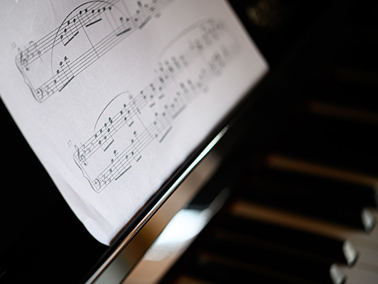 Closeup of a page of sheet music on a piano