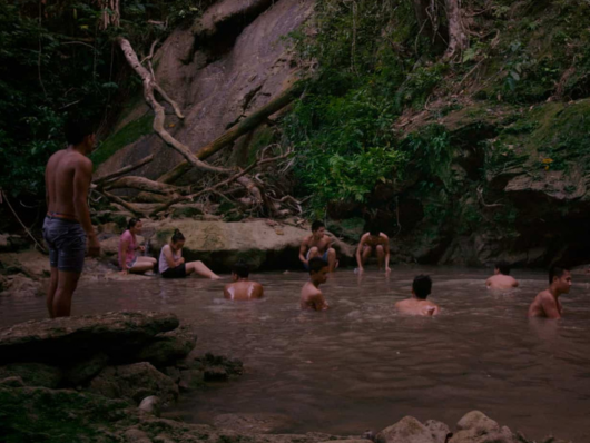 Group of people swim in a reservoir