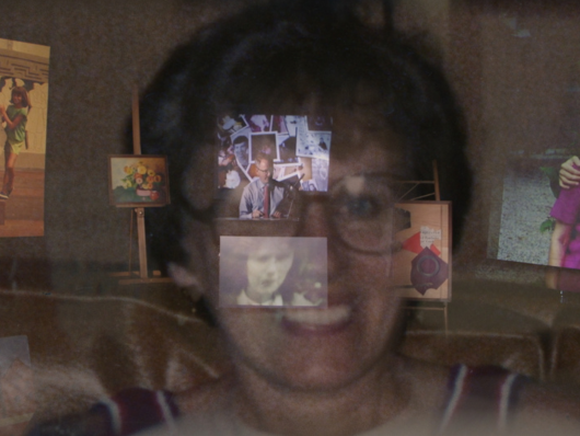 Screens with different media layered over the image of a woman smiling