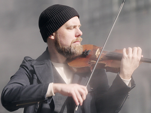 Modney playing the violin