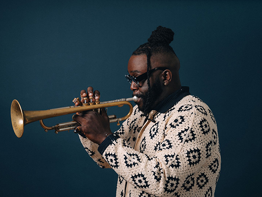 Marquis Hill plays the trumpet.
