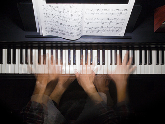 Hands playing keyboard