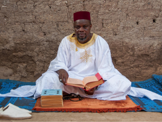 Man sitting, Amadou Traore