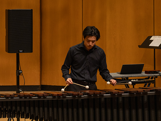 Percussion Ensemble member playing marimba