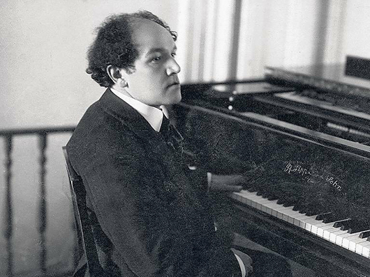 Nikolai Medtner seated at piano