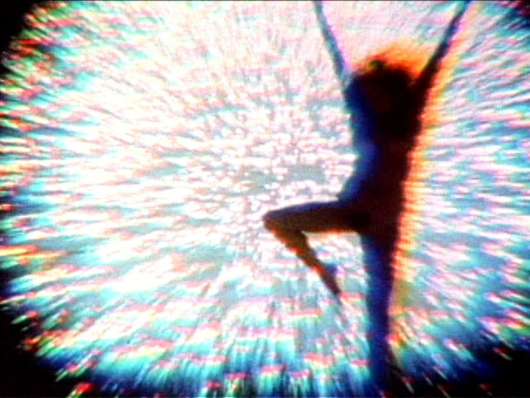 figure silhouetted against array of bright lights
