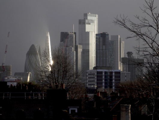 light reflects off of London skyline on overcast day