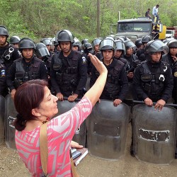 A woman protests mining in Guatemala