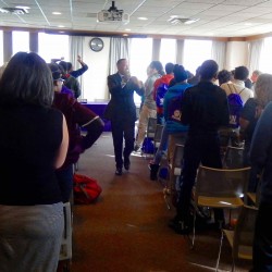 Alan Anderson, Executive Director of Northwestern's Office of Neighborhood and Community Relations brings ETHS students to their feet during Kits & Cats Day at Northwestern (Fall 2016).