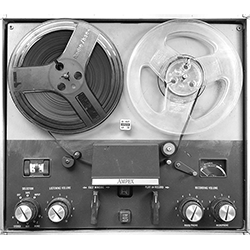 Image of anachronistic reel-to-reel tape player, shown in black & white