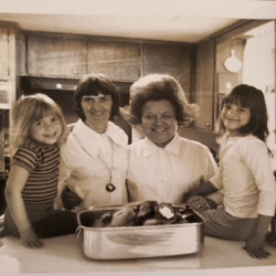 Three generations of women in a kitchen