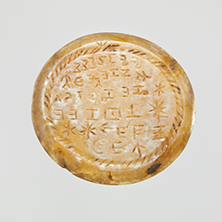 An onyx intaglio in The Met with charaktêres alongside Greek letters