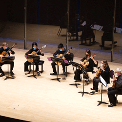 Guitar Ensemble performing on stage.