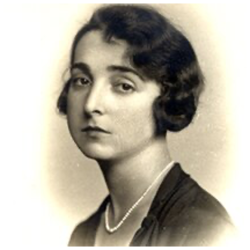 Photo of head and shoulders of Dolores Zohrab Liebmann. Dark hair and pearl necklace.