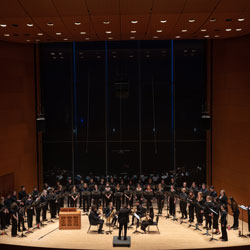 University Chorale performing at night in Galvin Recital Hall