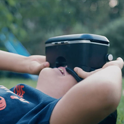 Young person using VR goggles