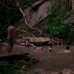 Group of people swim in a reservoir