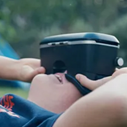 Young person looking through VR goggles