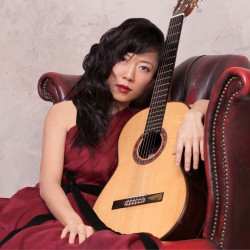 Xuefei Yang poses with her guitar.