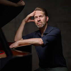 Leif Ove Andsnes sits at the piano.
