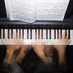 Hands playing keyboard