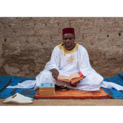 Man sitting, Amadou Traore