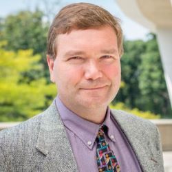 
								Headshot of Dr. Jonathan Lang