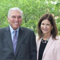 a man and a woman standing outside