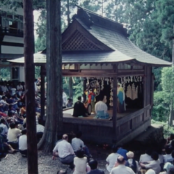 Japanese shrine with people gathering