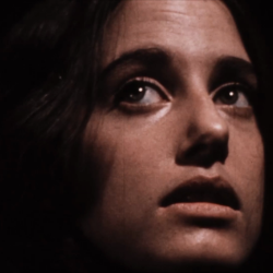 Close up of a woman's face in darkness