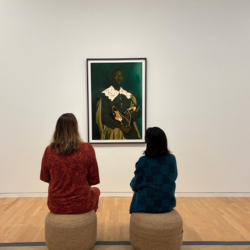 Women looking at art.