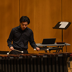 Percussion Ensemble member playing marimba