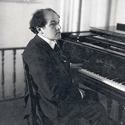 Nikolai Medtner seated at piano