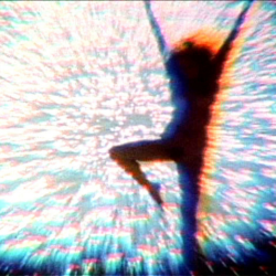 figure silhouetted against array of bright lights
